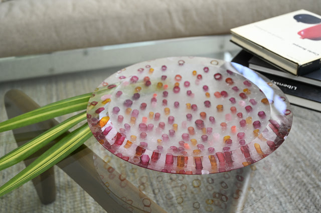Harvest Murrine Bowl sitting on top of the glass coffee table